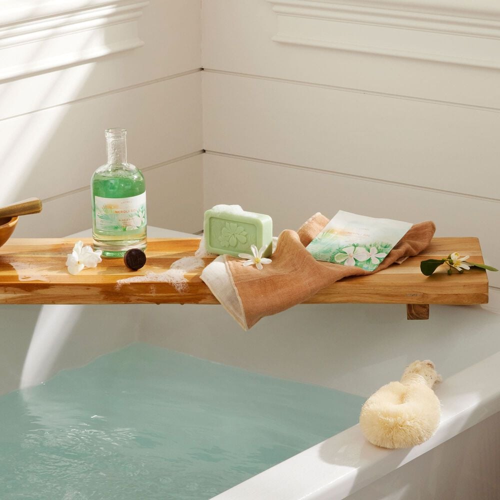 Thymes Neroli Sol Bath Salts Envelope for an Island Spa Experience on wooden tray on bath tub image number 1